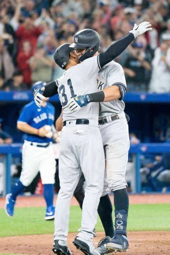 Aaron Hicks celebrates with Aaron Judge during the Astros vs. Yankees Baseball Game