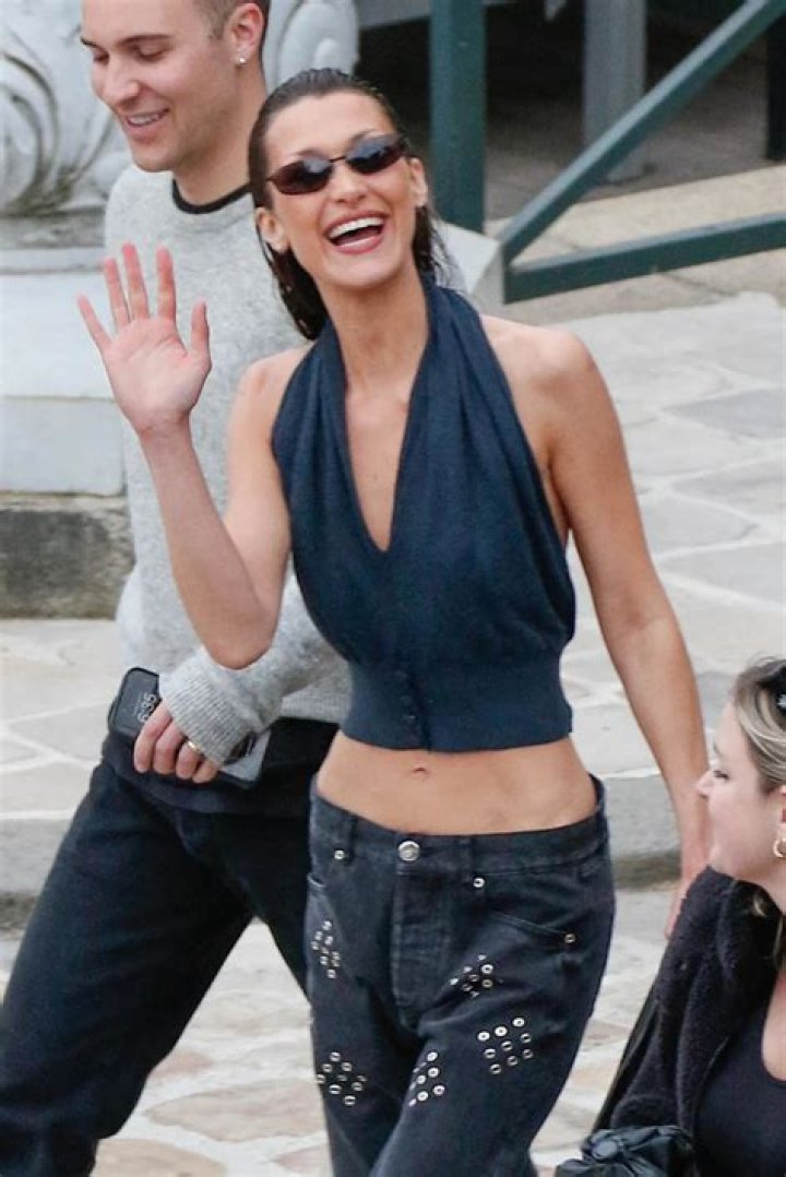 Bella Hadid is seen leaving Paris to fly back to New York after working at Paris Fashion week. 08 Mar 2022 Pictured: Bella Hadid. Photo credit: Neil Warner/MEGA TheMegaAgency.com +1 888 505 6342 (Mega Agency TagID: MEGA835801_012.jpg) [Photo via Mega Agency]