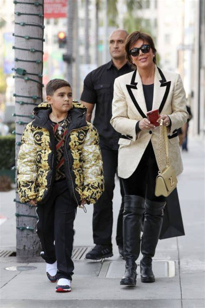 Beverly Hills, CA - Momager Kris Jenner gets her grandson Mason Disick an expensive looking Versace puffer jacket as they both go Christmas shopping in Beverly Hills with a bodyguard. Pictured: Kris Jenner, Mason Dash Disick BACKGRID USA 18 DECEMBER 2018 BYLINE MUST READ: Clint Brewer / BACKGRID USA: +1 310 798 9111 / UK: +44 208 344 2007 / *UK Clients - Pictures Containing Children Please Pixelate Face Prior To Publication*