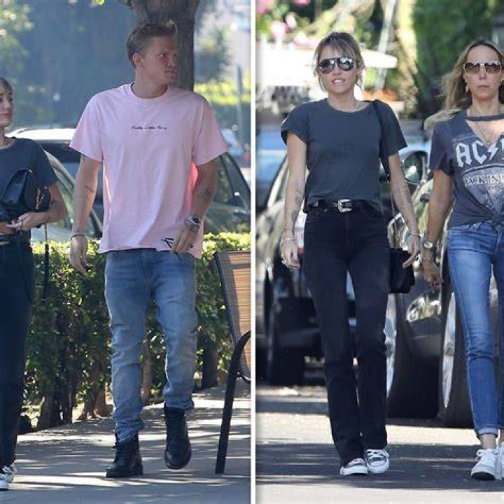 Cody Simpson carries Miley Cyrus