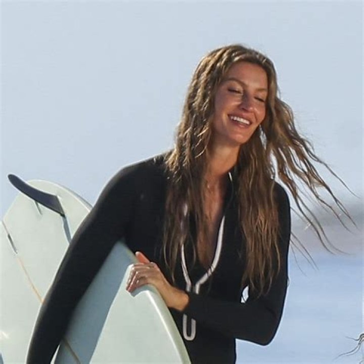 Gisele Bundchen surfing