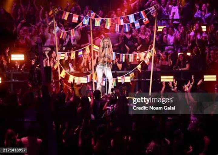 Karol G Performs On Stage At Premios Juventud