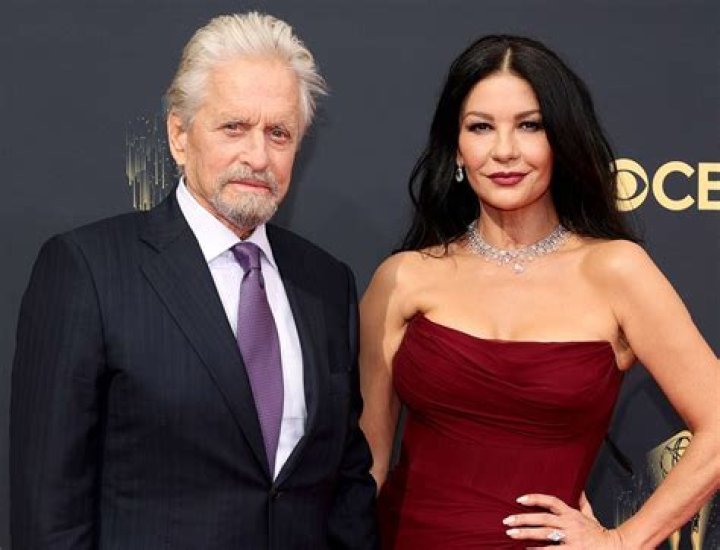 Michael Douglas and Catherine Zeta Jones sitting