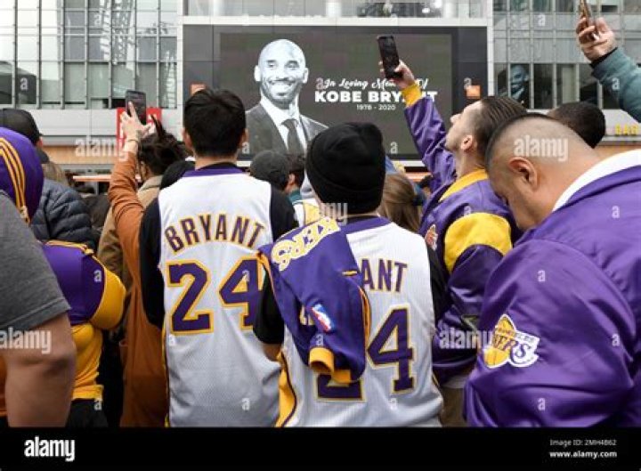 People gather outside Staples Center after the death of Laker legend Kobe Bryant, in Los Angeles Obit Bryant Basketball, Los Angeles, USA - 26 Jan 2020
