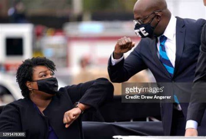Raphael Warnock Bumps Elbows With Joe Biden