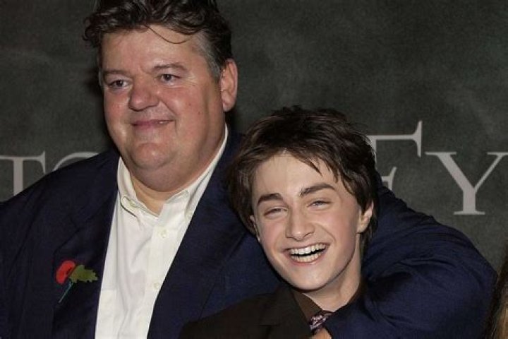 Robbie COltrane and Daniel Radcliffe pose on the red carpet together at a 'Harry Potter' premiere