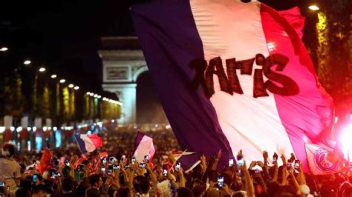 The crowd invades the Champs Elysees avenue, with the Arc de Triomphe in background, to celebrate after the semifinal match between France and Belgium at the 2018 soccer World Cup, in Paris. France advanced to the World Cup final for the first time since 2006 with a 1-0 win over Belgium on TuesdayWCup Soccer, Paris, France - 10 Jul 2018